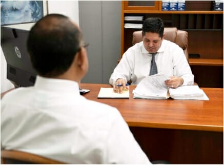 Elder law attorney reviewing papers in office