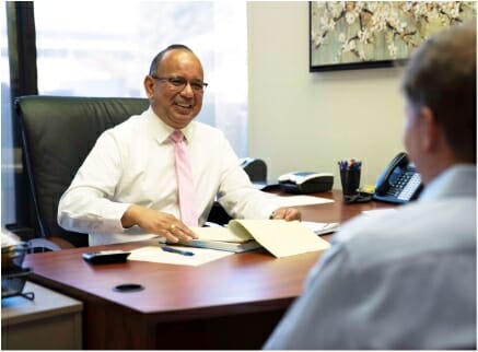 Estate planning attorney reviewing papers in office